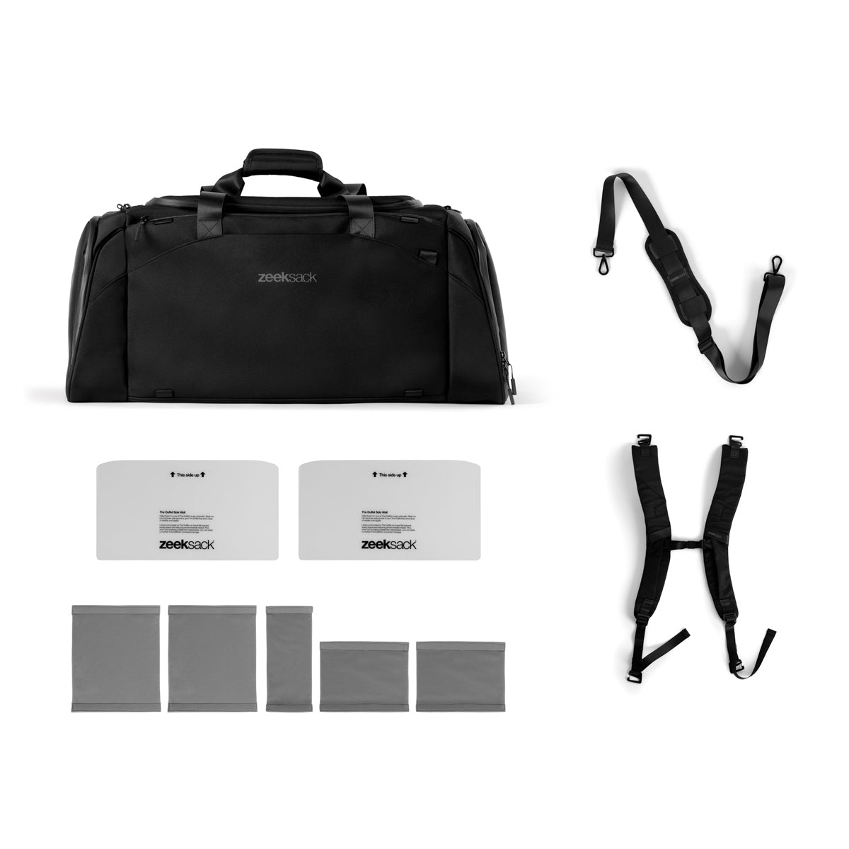 The Duffelbag med alt innhold lagt ut: skulderrem, ryggsekkstropper, avdelere og bunnskivor.