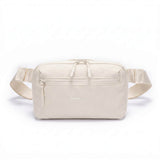 Zeeksack Crossbody Organizer (sandfarget) – skulderrem og frontlomme med glidelås.