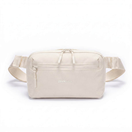 Zeeksack Crossbody Organizer (sandfarget) – skulderrem og frontlomme med glidelås.