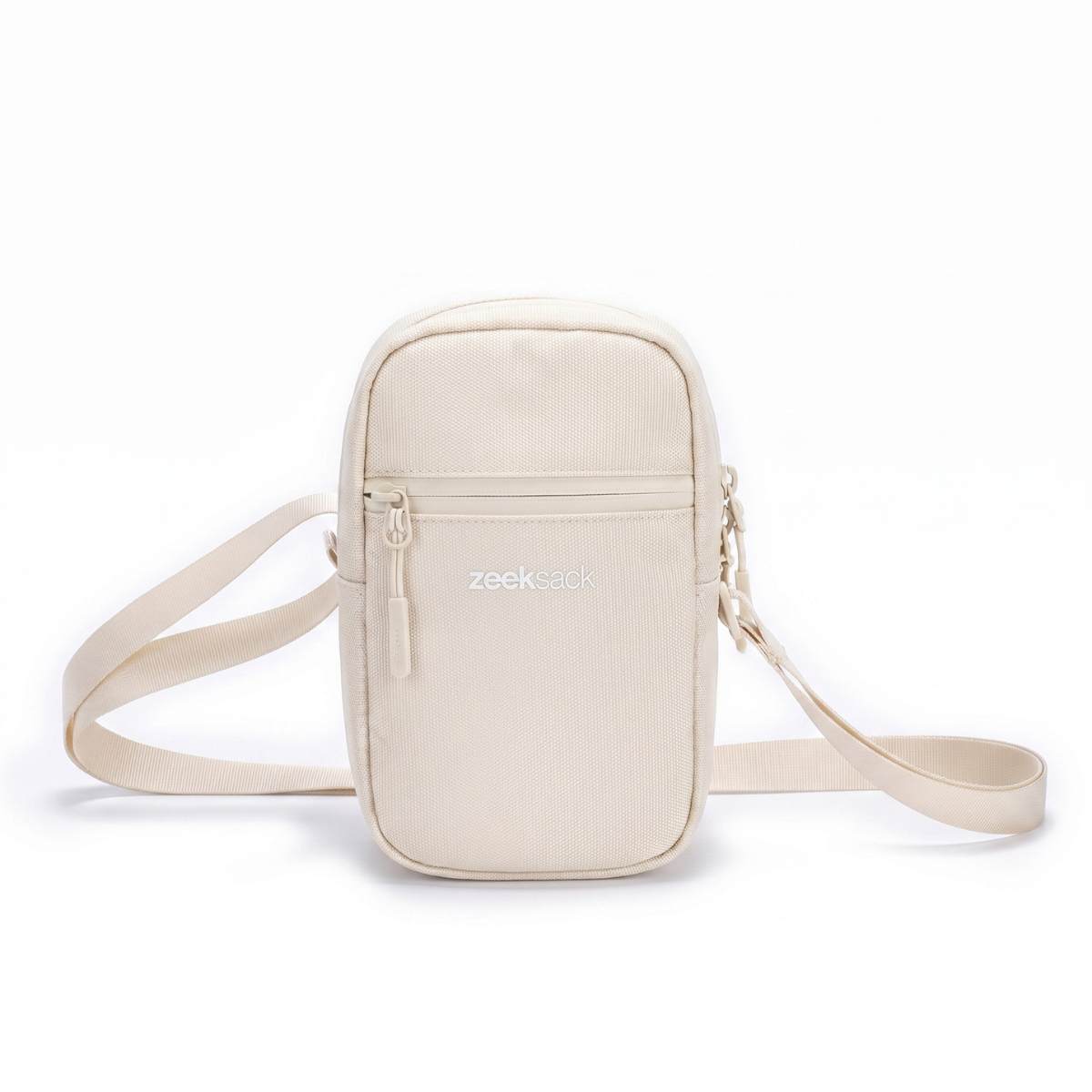 Zeeksack Travel Pouch (sandfarget) – skulderrem og frontlomme med glidelås.