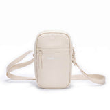 Zeeksack Travel Pouch (sandfarget) – skulderrem og frontlomme med glidelås.