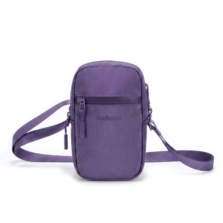Zeeksack Travel Pouch (lilla) – skulderrem og frontlomme med glidelås.